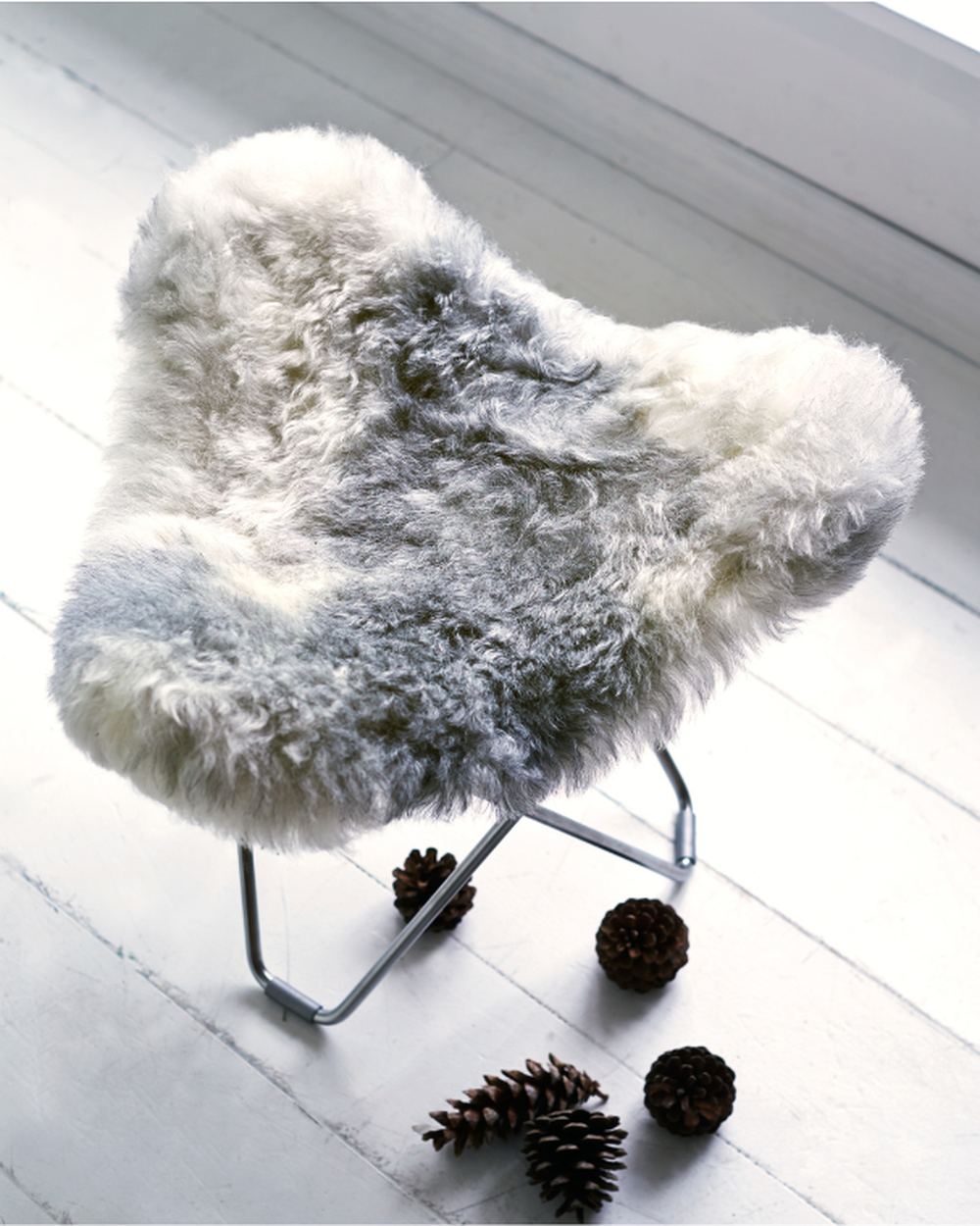 sheepskin stool grey and white pine cone