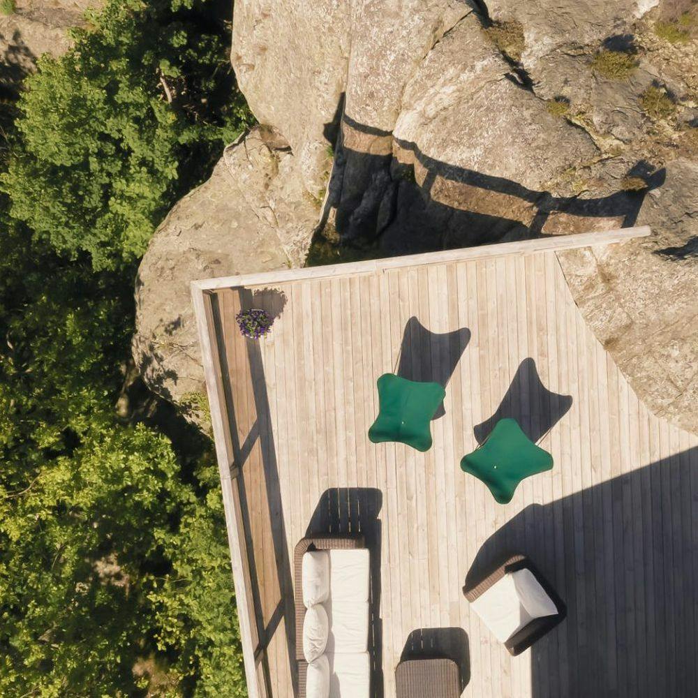 aerial vue of green outdoor butterfly chairs on wooden deck