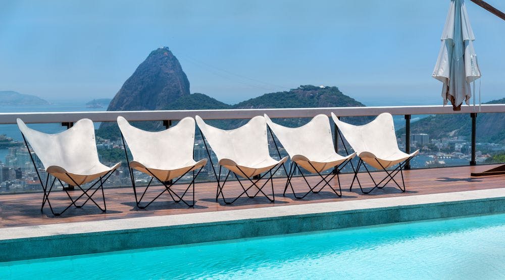 white outdoor butterfly chairs rio de janeiro sunny poolside