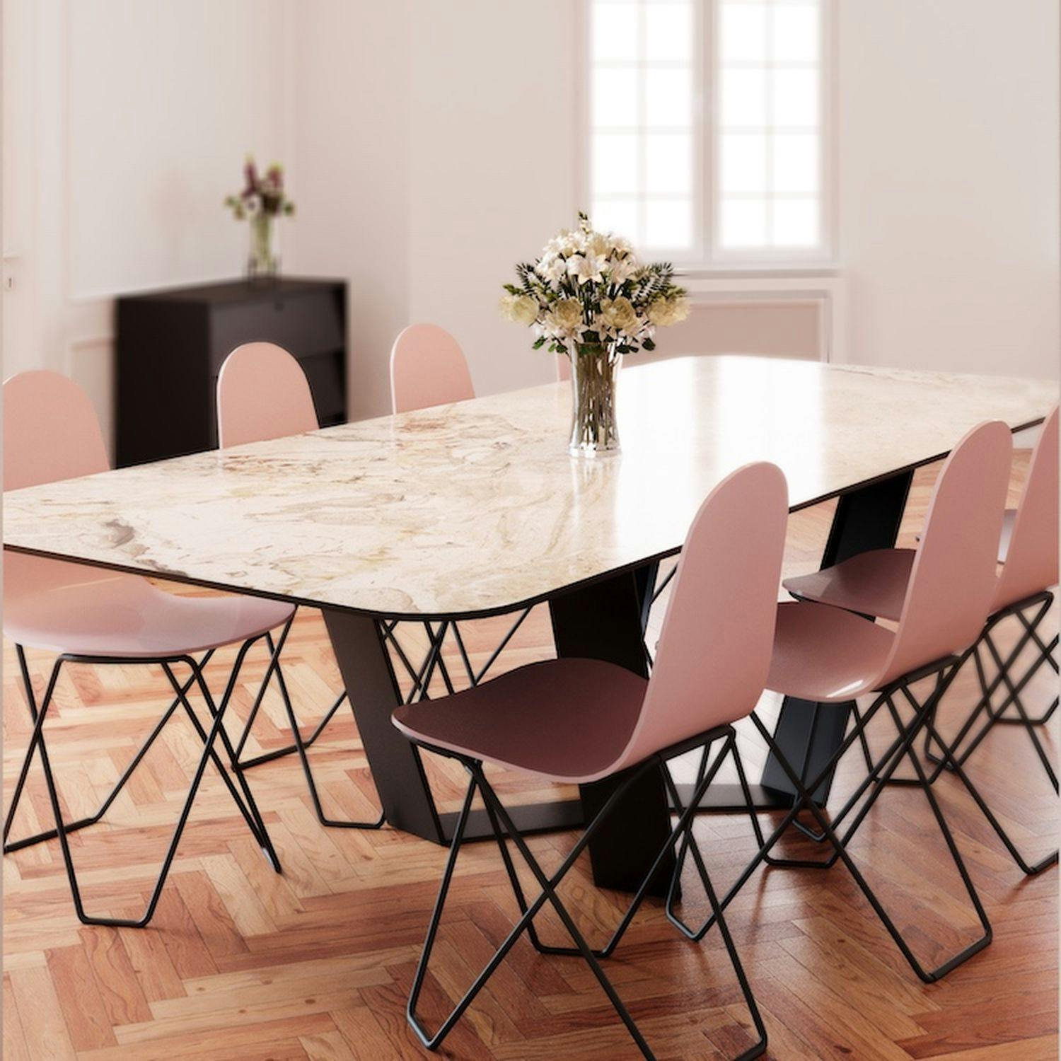 Pink dining chairs with sheepskin lamps above