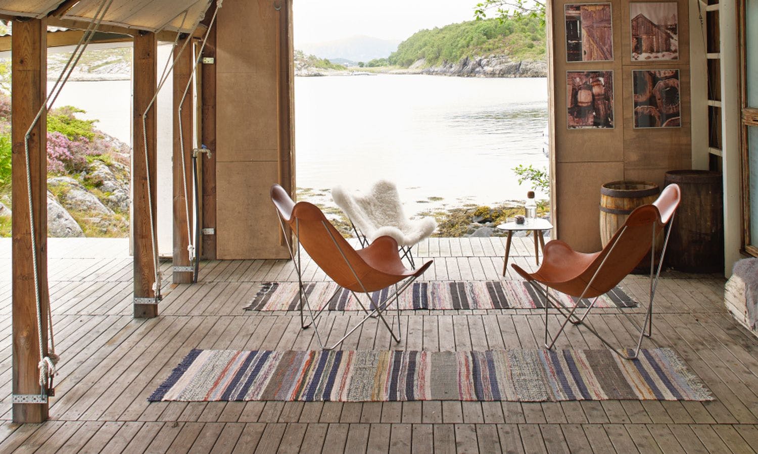 Two leather butterfly chairs and one sheepskin bkf in Norwegian fjord house